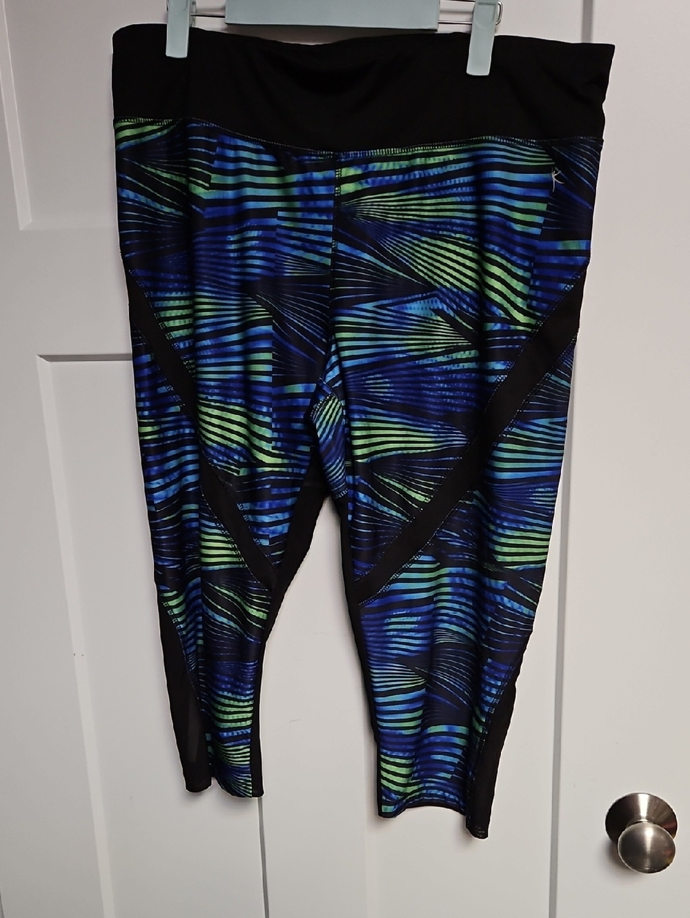 Danskin Black Capri Leggings with Blue and Green Stripe Accents